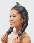 A black satin heatless curler with two included scrunchies.