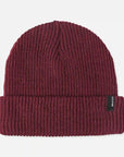 On a white background is a mahogany knit beanie with a black small label on the cuffed edge.