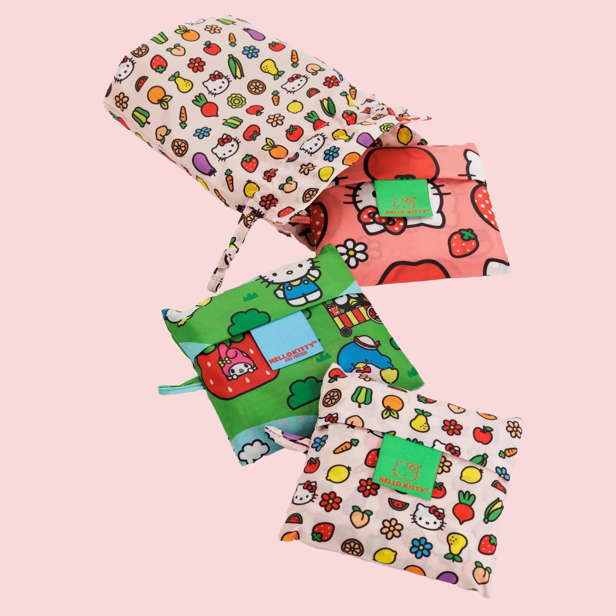 A set of three standard Baggu tote bags with three different Hello Kitty prints on them. 