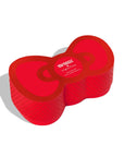 A red bow shaped box filled with two containers of candy.