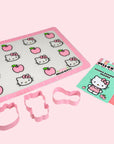 A set of baking accessories in hello kitty shapes and designs.
