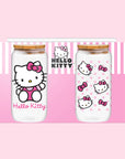 A set of two glass tumblers with hello kitty designs and glass straws.