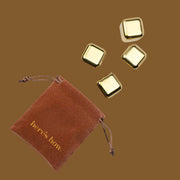 A set of four gold ice cubes.