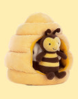A bee shaped stuffed toy along with a honeybee hive shaped toy.