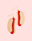 A pair of hot dog shaped earrings.
