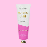 A white and pink tube of hand cream with gold text that reads, 'Hot Girl Shit Intensely Moisturizing Hand Creme'.