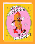 On an orange background is an orange and pink card with an illustration of a smiley face hot dog with text above and below that reads, "Well, Hotdog! It's Ur Birthday".