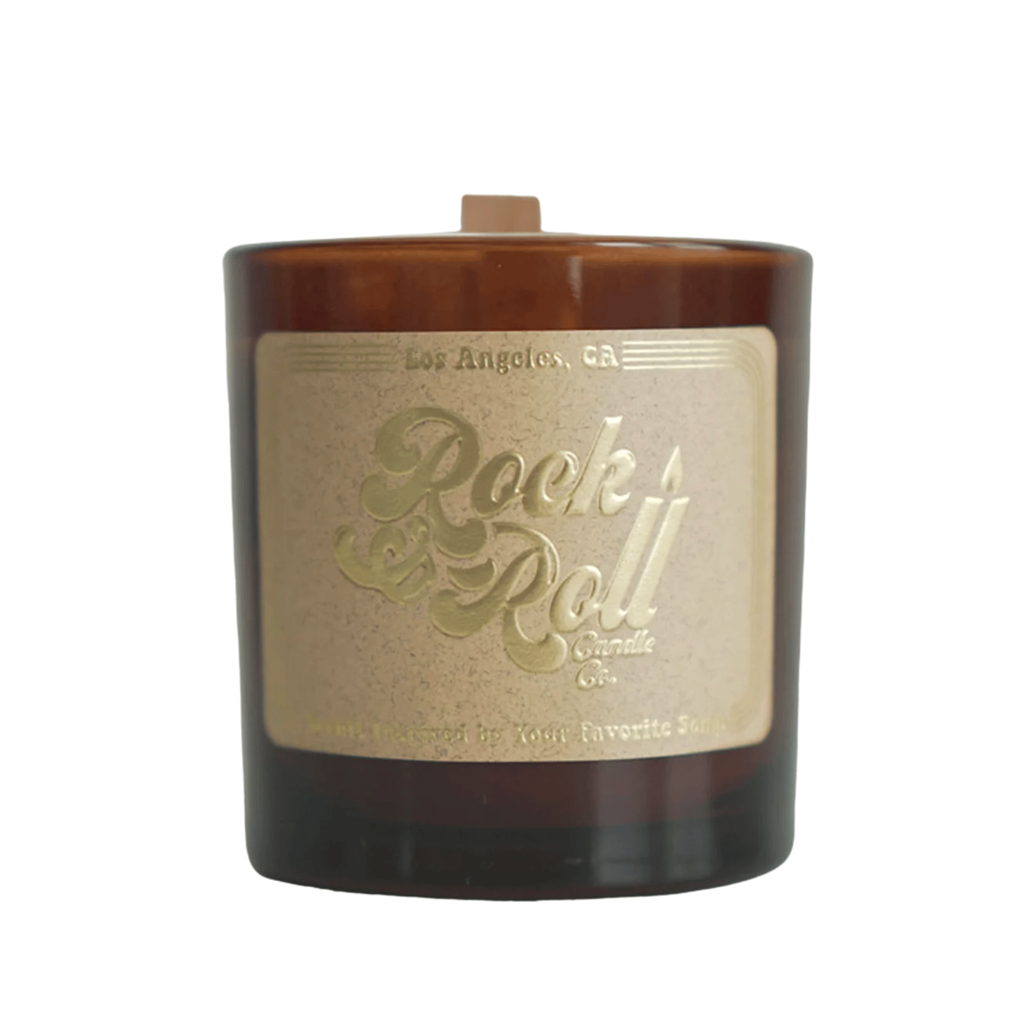 On a white background is a brown glass candle with a Kraft brown label on the front with a gold text that reads, "Rock & Roll Candle Co".