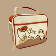 A tan and burnt red lunch box with a zipper closure and a horse and rope design that reads, 'Yee Haw'.