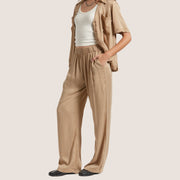 A pair of tan lounge pants with a scrunched waist band.