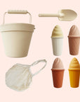 A beach play toy set with a bucket, a shovel, a bag, and four ice cream shape molds.