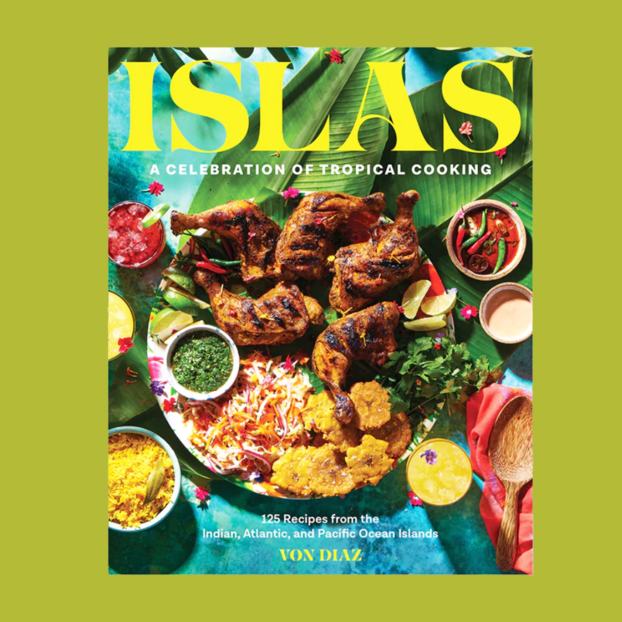 On a bright green background is a colorful book cover with a plate full of grilled food and the title above that reads, "Islas A Celebration of Tropical Cooking".