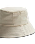 An ivory bucket hat with a small square pocket on the side.
