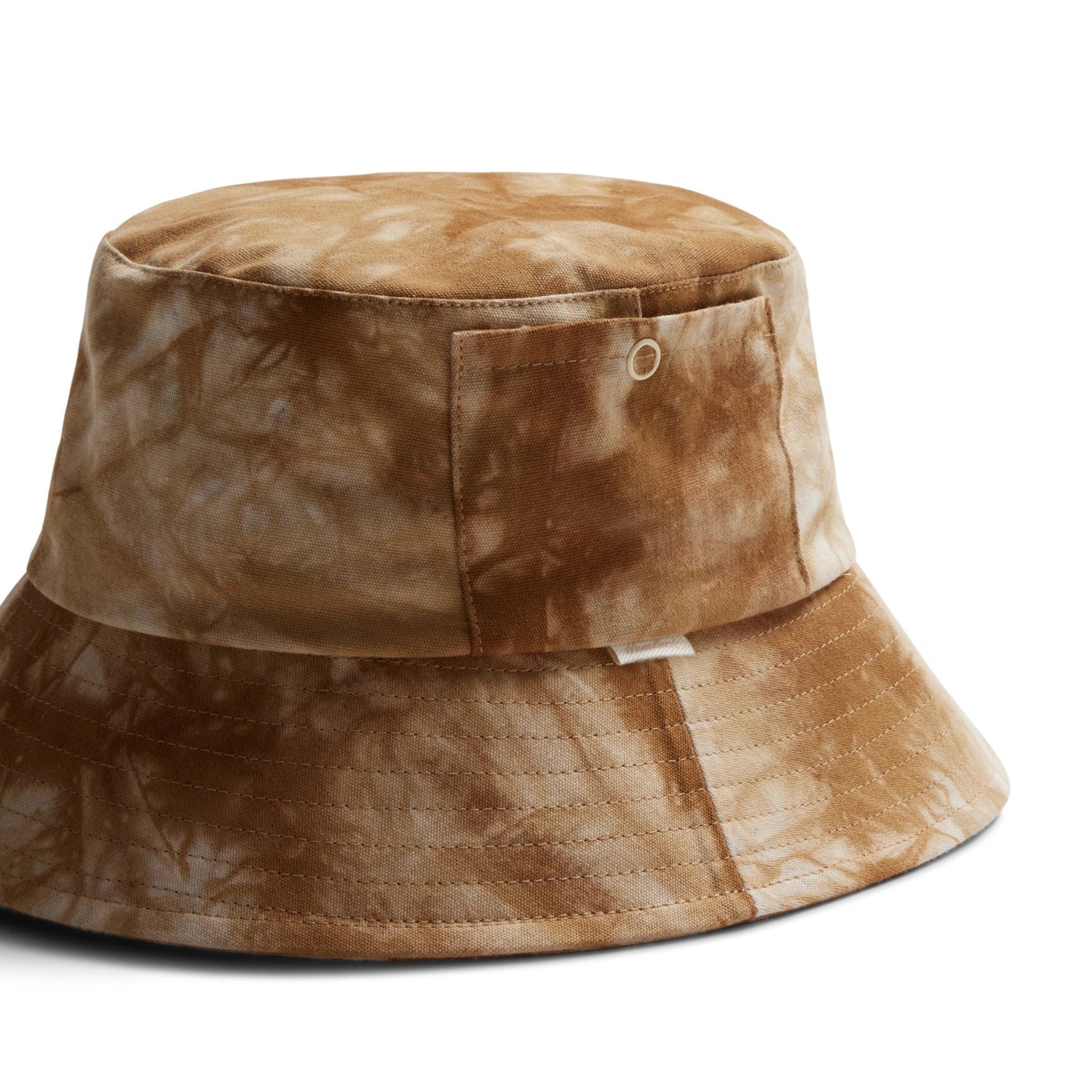 An ivory and tan tie dye bucket hat. 