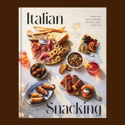 A neutral book cover with a spread of Italian small bites and black text that reads, "Italian Snacking'.