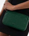 deep green crossbody bag on model