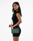 deep green crossbody bag on model
