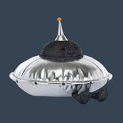A silver and sparkle grey space saucer shaped stuffed toy.