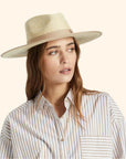 A neutral tan and natural colored rancher hat.
