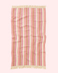 A pink striped waffle knit bath towel.