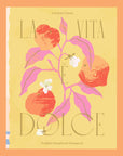 On an orange background is a yellow book cover with a fruit and foliage graphic with the title that reads, "La Vita E Dolce Italian Inspired Desserts".