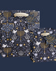 A gift bag with a menorah and dove design.