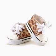 A leopard print pair of converse inspired sneakers for Minikane dolls.
