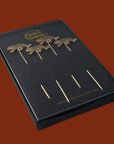 A gold leopard cocktail pick set of four.