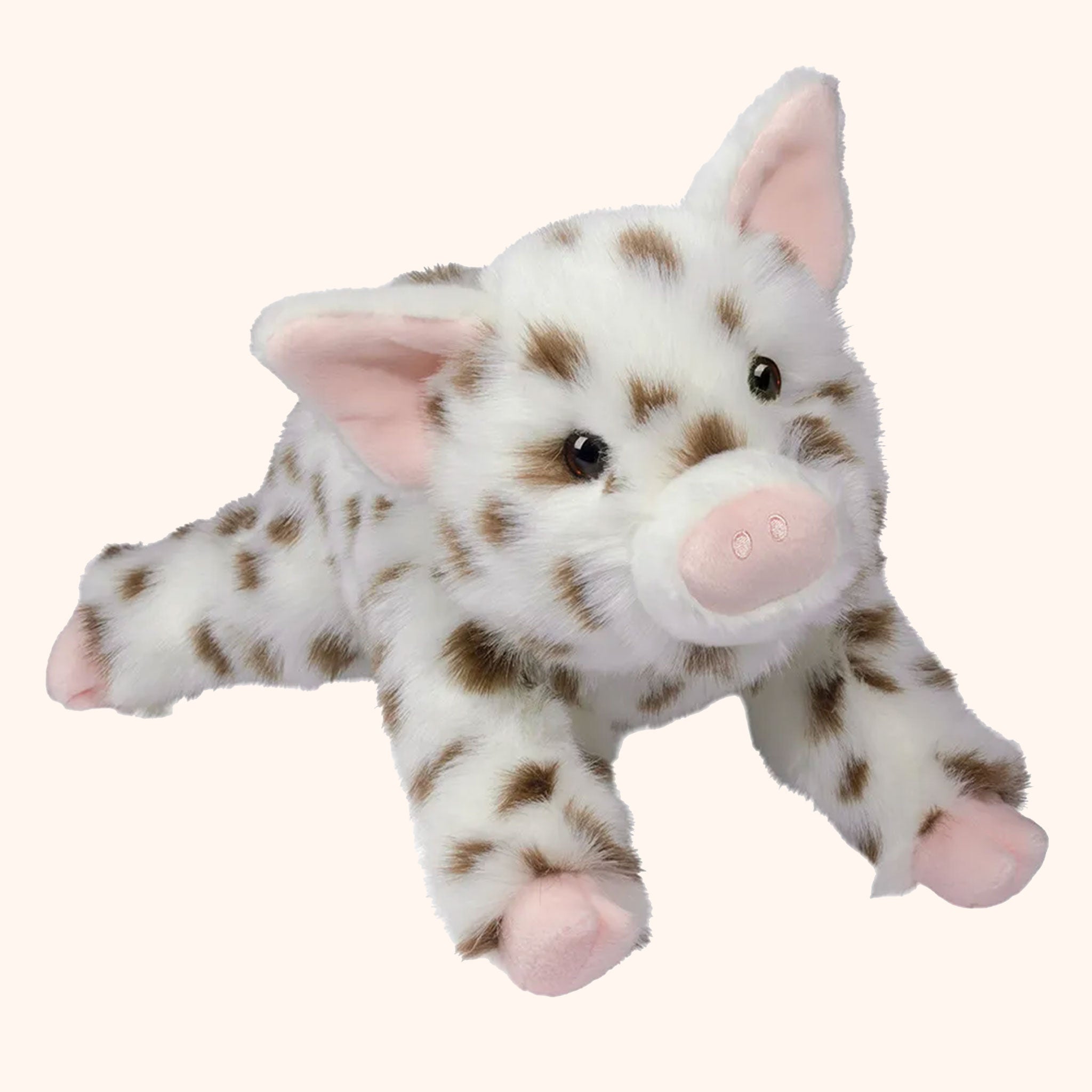 On a white background is a blue and brown stopped pig stuffed animal. 