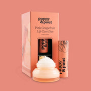 A box filled with a lip scrub and apricot colored lip balm tube.