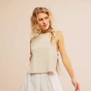 A beige knit sweater tank top.