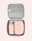 A pink and peachy colored striped lunch box with a double zipper and handle for carrying. Water bottle and food container not included with purchase.