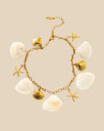 A seashell and gold seashell / starfish bracelet.