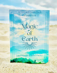 A deck of cards with a box cover of the sky and landscape and text that reads, "55 Card Oracle Deck & Guidebook Magic of Earth".