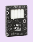 A set of 12 taper candles in a black box with text that reads, "Magic Spell Candles".