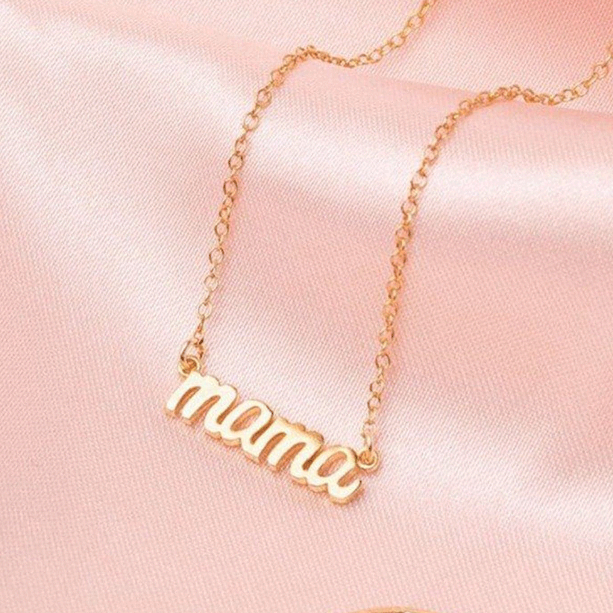 A dainty chain necklace with a small &quot;mama&quot; charm.