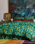 A green and yellow floral print duvet cover.