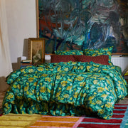 A green and yellow floral print duvet cover.