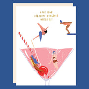 A white card with a graphic of a martini glass and divers swimming in it with text that reads, 'Make Your Hangover Worth It'.