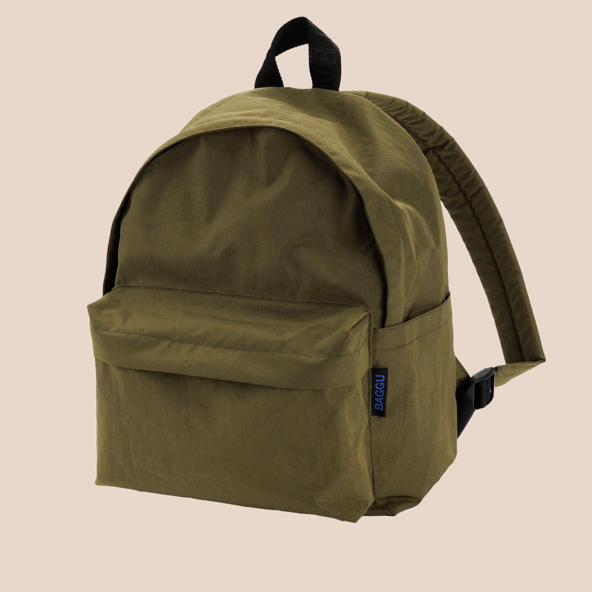 A dark green nylon backpack with side pockets,  two front zipper compartments and black straps. 