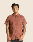 A reddish brown short sleeve button up shirt.