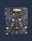 A dark blue gift bag with a menorah and dove design.