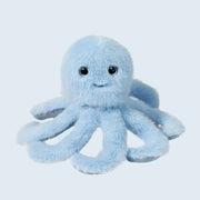 On a blue background is a light blue octopus shaped stuffed toy with a smiling face.