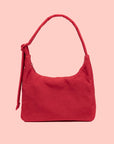 A red nylon shoulder bag with an adjustable strap.