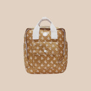 A mustard yellow and ivory floral mini backpack.