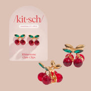 A pair of cherry shaped red and green rhinestone mini hair clips.