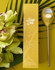 A chartreuse moisture meter with a rounded head and a white meter that ranges from dry, moist, or wet along with a small oval label in the front that reads, "Jungle Club".