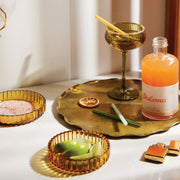 A set of two different sized amber colored ribbed tray bowls.