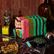 A multicolored stripe terry cosmetic pouch.