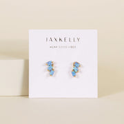 A pair of earrings with three offset fire opal stones.